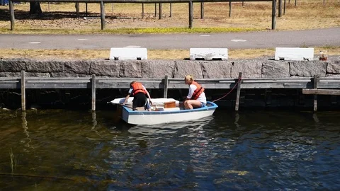 Mother and son preparing small sailboat Stock Footage 93121824