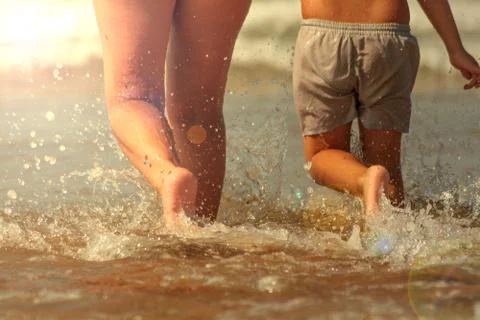 Mother and son running Stock Photos
