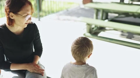 Mother and son sharing a picnic lunch outdoors Stock Footage 319647655