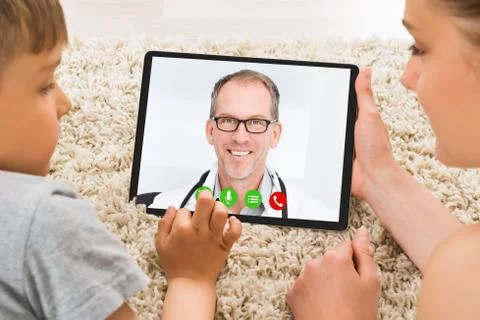 Mother And Son Solving Math Problem On Digital Tablet 스톡 사진