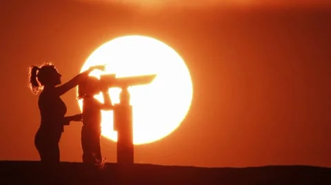 Mother and son with telescope in the Sunset Stock Footage 8259953