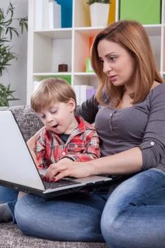Mother and son using computer Stock Photos