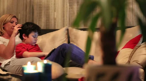 Mother and son using digital tablet 2 Video stock 37874922