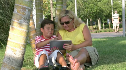 Mother and son using digital tablet Stock Footage 41606631