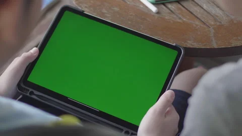 Mother and son using digital tablet together green screen chroma key Stock Footage 279653407