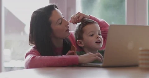 Mother and Son using laptop Stock Footage 84811374