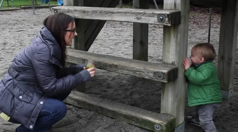 A mother and toddler at park Stock Footage 59125554