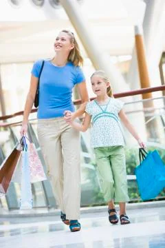 Mother and young daughter at a shopping mall Stock Photos