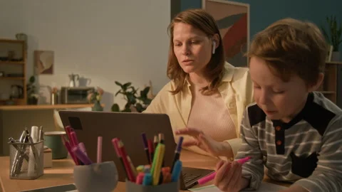 Mother Asking Little Son to Keep Quiet as She Starting Online Meeting on Laptop Stock Footage 313746817