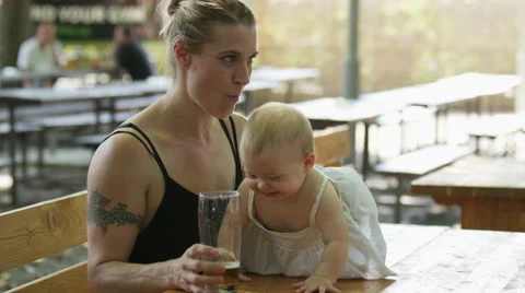 Mother Baby Chase Beer - 4k Stock Footage 59162620