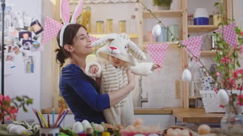 Mother with baby decorating easter eggs. Stock Footage 175857442