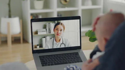 Mother with baby making video call, Stock Video Pond5