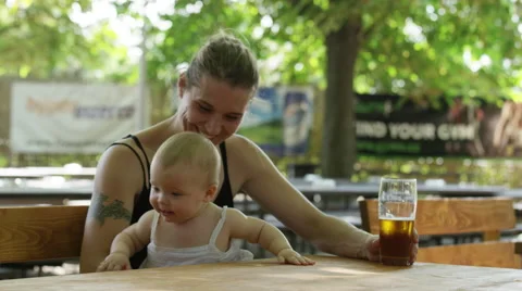 Mother Baby Outdoor Beer Shake - 4k Stock Footage 59161973