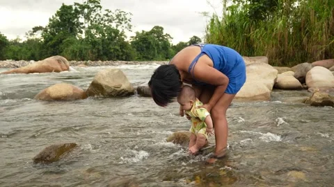 Mother Bathing Son in River in Amazon Region of Ecuador Stock Footage 312149494