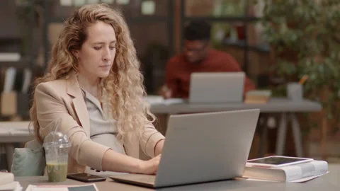 Mother-to-be Using Portable Computer Video stock 183330558