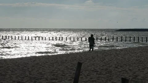Mother on the beach in the sunset Stock Footage 218427416