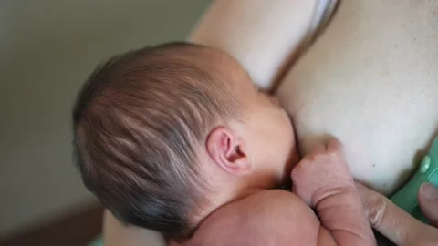 mother breastfeeds baby. newborn sucking... | Stock Video