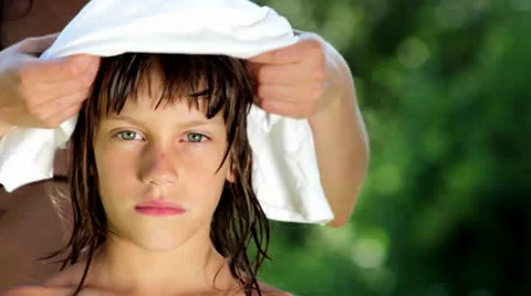 Mother changes clean clothes for her yong son Stock Footage 24921117