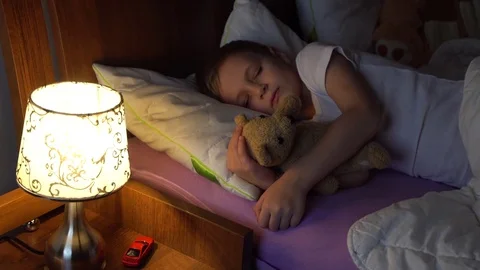 Mother checking hers sleeping son Stock Footage 72986520