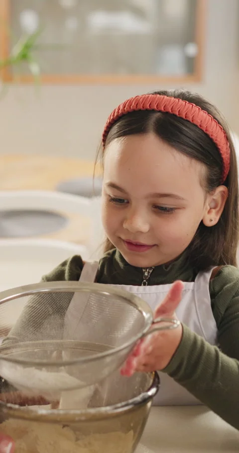 Mother, child and baking in kitchen with flour, sieve and bonding together for Stock Footage 332488682
