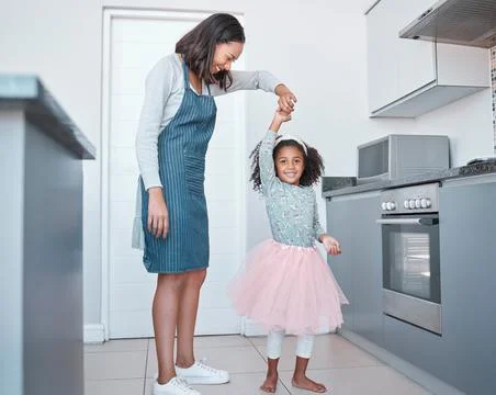 Mother, child and dancing in home kitchen for love, energy and fun together as a Stock Photos