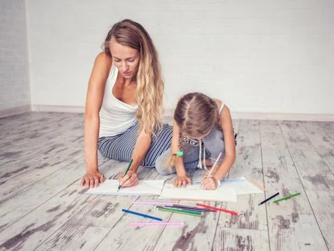 Mother with child drowing Stock Photos