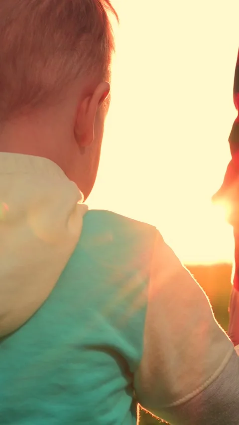 Mother child join hands, going to take quiet walk in field. Dreamy toddler baby Stock Footage 282891101