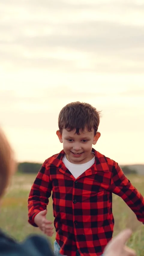 Mother child kid boy son parent hugs happy family dream running flight field Stock Footage 295807633