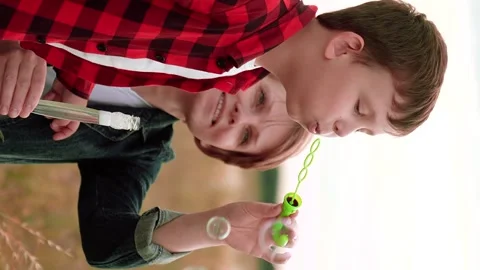 Mother child kid Son Soap Bubbles, happy family, mother delighted her son Stock Footage 299738951