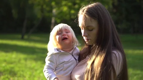Mother with crying baby Stock Footage 84576084