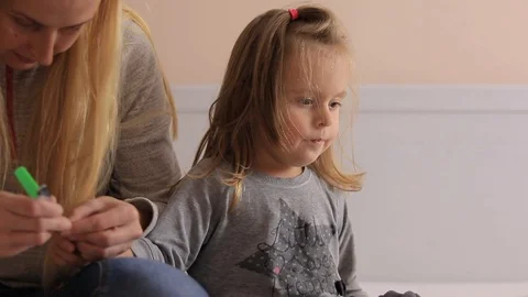 Mother cuts to the kid nails Stock Footage 100234802
