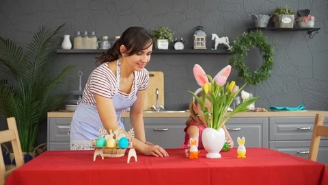 Mother with Daughter Decorating Easter Table Stock Footage 124522636