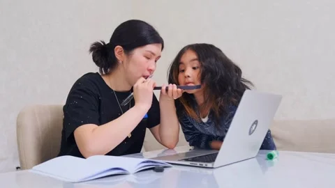 Mother daughter makeup sharing activity, enjoying fun makeup bonding experience Stock Footage 326448084