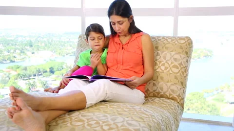 Mother daughter reading Stock Footage 46252080