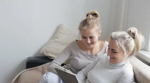 Mother with daughter using tablet Stock Footage 68564683