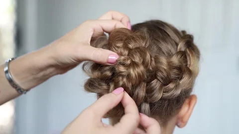 Mother do hair braid to her daughter, close up video Stock Footage 124074512