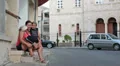 Mother embracing and kissing child at summer street HD Footage
