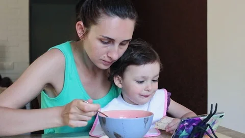 Mother feeds the child. Stock Footage 90279237