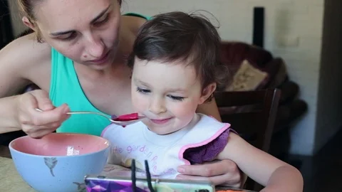 Mother feeds the child. Stock Footage 90285513