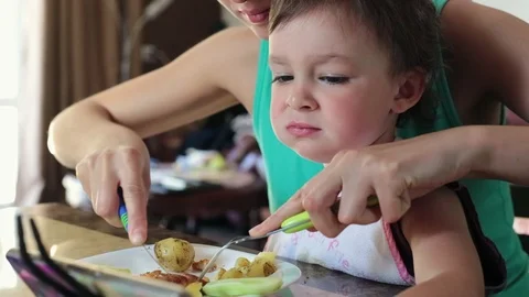 Mother feeds the child. Stock Footage 90285754