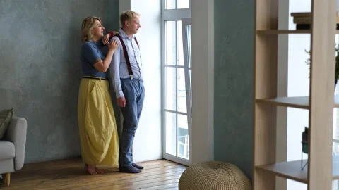 Mother with Grown Son Talking by the Window Stock Footage 158887150