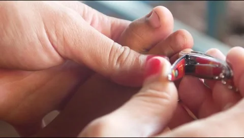 A mother hands cut her child toenails Stock Footage 313735081