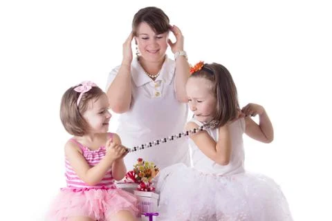 Mother having headache of two daughters quarreling Stock Photos