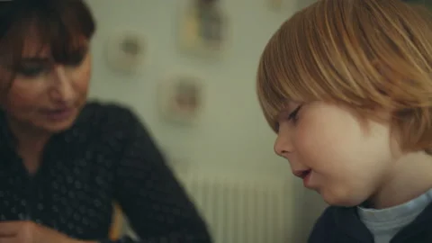 Mother help her son to do homework. lifestyle and education concept. film grain Stock Footage 130906190