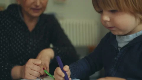 Mother help her son to do homework. lifestyle and education concept. film grain Stock Footage 130906197