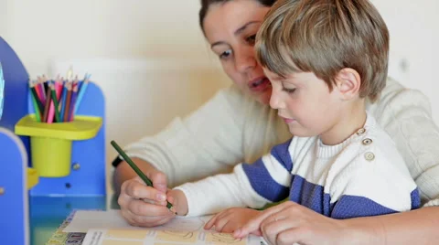 Mother helping her kid to make drawings Stock Footage 48953093