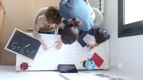 Mother helping her son do homework back to schoo Vídeos de archivo 270483745