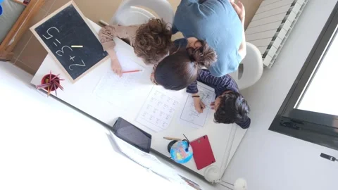 Mother helping her son do homework back to schoo Vídeos de archivo 270483746