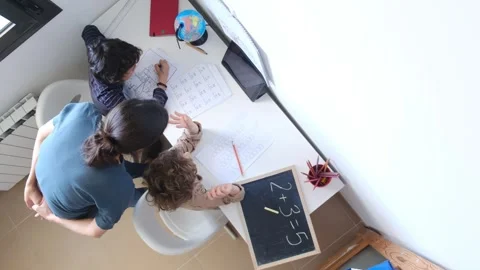 Mother helping her son do homework back to schoo Vídeos de archivo 270483754
