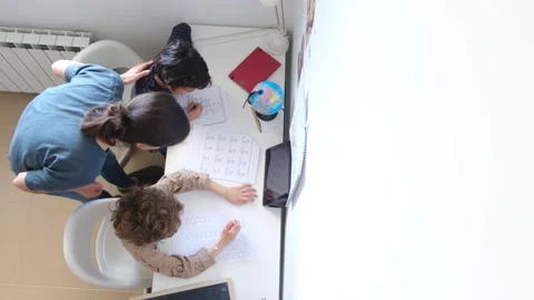 Mother helping her son do homework back to schoo Vídeos de archivo 270483758